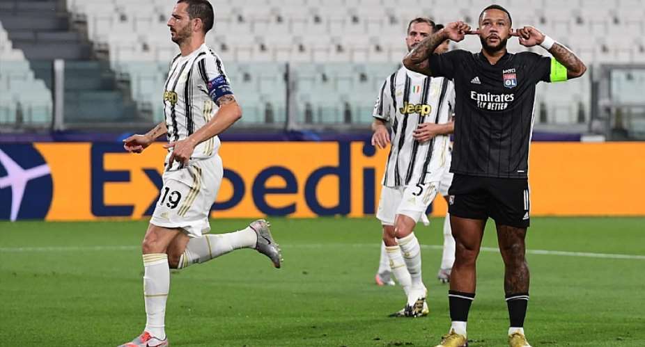 Lyon's Dutch forward Memphis Depay R celebrates scoring his team's first goal during the UEFA Champions League round of 16 second leg football match between Juventus and Olympique Lyonnais OL, played behind closed doors due to the spread of the COVID-Image credit: Getty Images
