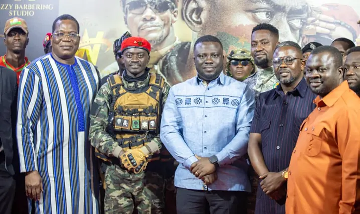 The ambassador in a pose with Lil Win, others