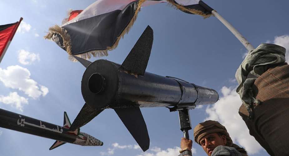 A Houthi supporter chants slogans as he carries a rocket replica during an anti-US and anti-Israel rally in Sana following Israeli airstrikes on September 26, 2025. -  Osamah Abdulrahman, AP