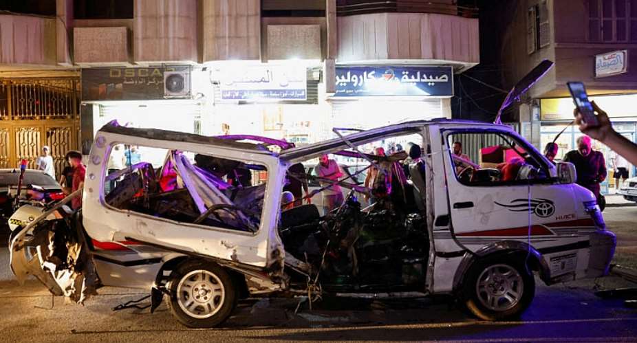 People look at a damaged vehicle following an explosion, in Jaramana, Damascus countryside, Syria, August 6, 2026 -  Reuters