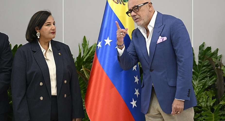 The president of the National Assembly of Venezuela, Jorge Rodrguez  talks with former opposition deputy Dinorah Figuera. -  Federico Parra, AFP