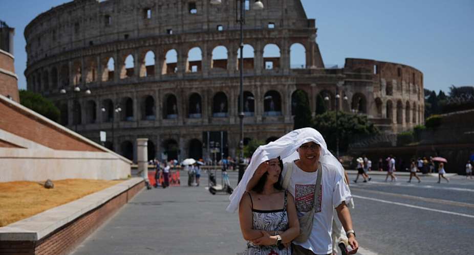 File photo of tourists trying to shelter from the sun near Romes Colosseum taken August 1, 2026. -  Alessandra Tarantino, AP