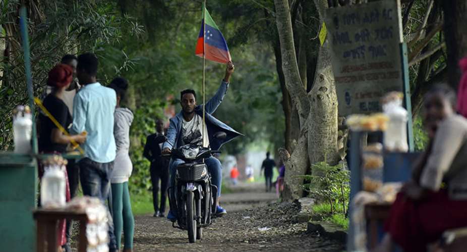 A man rides a motorcycle as young people of the Sidama ethnic group, the largest in southern Ethiopia, celebrate at Hawassa city over plans by local elders to declare the establishment of a breakaway region for the Sidama, in Awasa, July 15, 2019. Authorities arrested three media workers from the Sidama Media Network on July 18. AFPMichael Tewelde