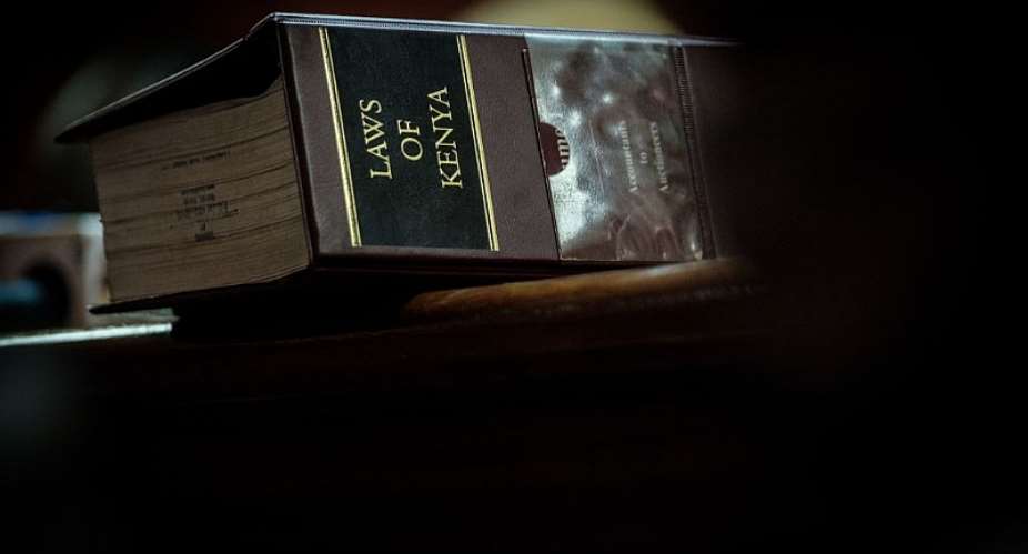 A volume of the Law of Kenya sits on a judgeamp;39;s desk during trial.  - Source: Yasuyoshi ChibaAFP via Getty Images
