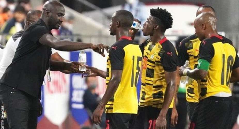 Flashback: Coach Otto Addo, (left) interacting with a section of Black Stars players after his appointment in February.