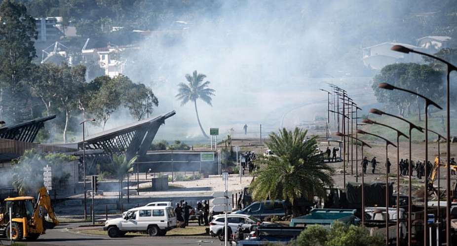 French gendarmes remove a roadblock during clashes with pro-independence protesters in Dumbea, New Caledonia, on 24 June 2024. Six Kanak activists have filed a complaint against four current or former French ministers over their arrests and transfers during the 2024 unrest. -  Delphine Mayeur/AFP