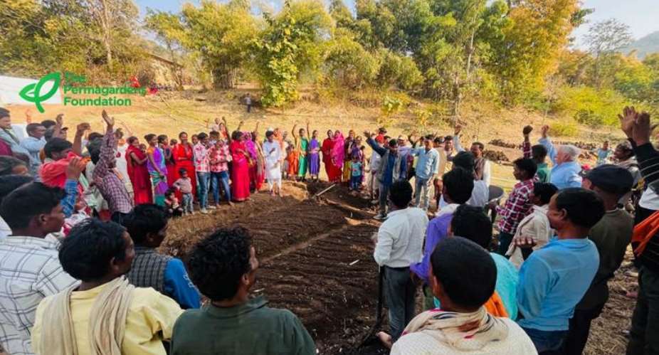 Community gathered around garden bed