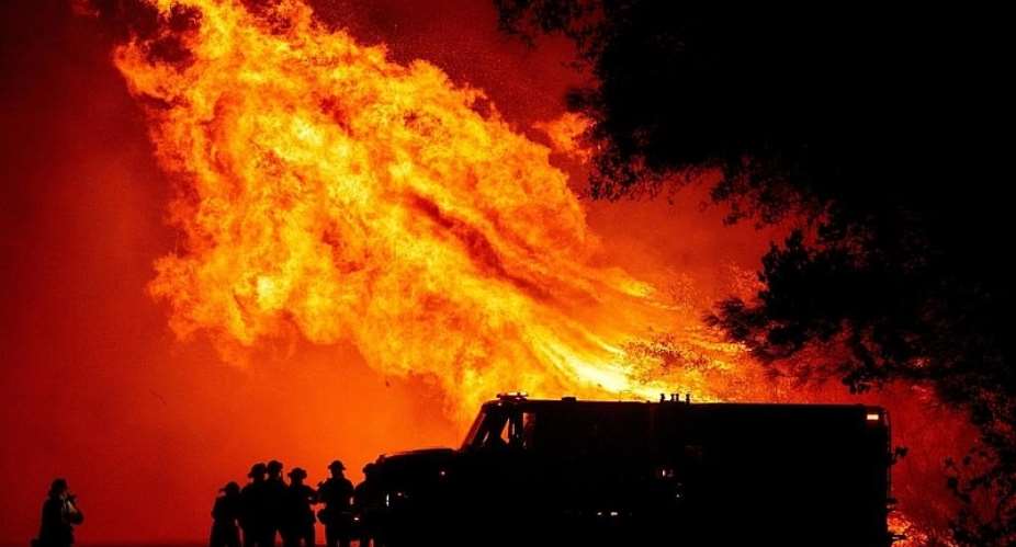 At least eight dead as California inferno surges north into Oregon