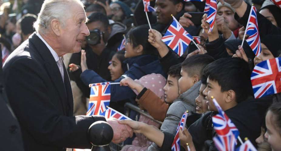 Charles III shakes hands during a visit to Brick Lane in London: The monarch enjoys a special status