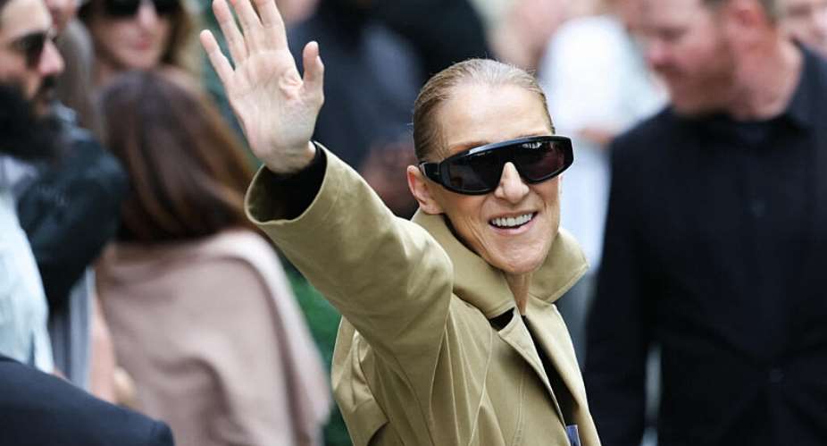 Canadian singer Celine Dion waves to fans as she arrives at Hotel Le Royal Monceau in Paris on 28 August 2026, ahead of her series of concerts in the French capital. -  AFP - THOMAS SAMSON