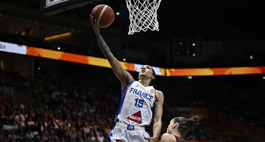 France forward Gabby Williams scores against Germany in the semi-finals of the womens World Cup. -  Tobias SCHWARZ / AFP
