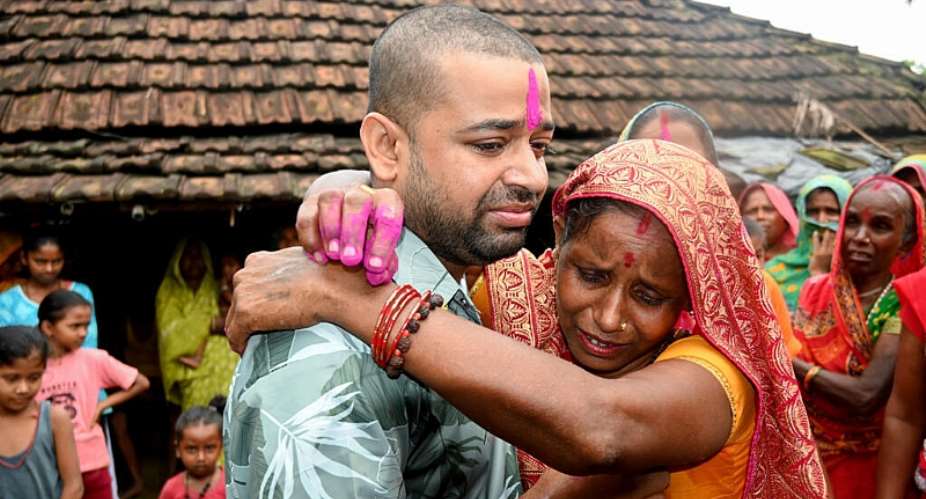 Nepali hydropower worker Sanjay Sah meets his mother at his residence in Nepals Saptari district on September 13, 2026 after being rescued from a flooded tunnel in the aftermath of deadly flash floods. -  Deepesh Deo Joshi, AFP
