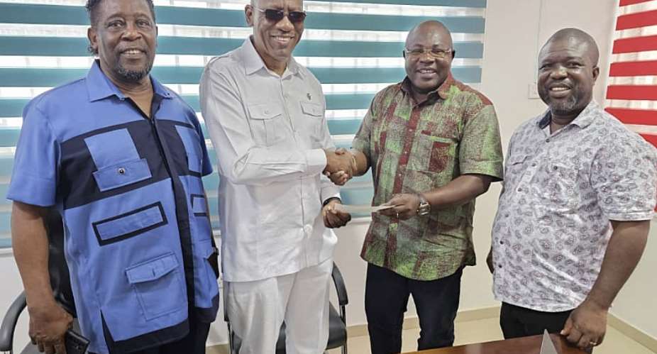 Leslie Mensah Tamakloe in white donating the money to the party executives