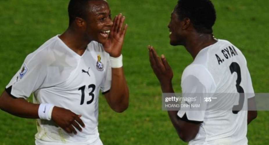 Ghana's striker Asamoah Gyan R celebrates with midfielder Andre Ayew after scoring a penalty kick the Group D first round 2010 World Cup football match Serbia vs Ghana on June 13, 2010 at Loftus Verfeld stadium in TshwanePretoria. Ghana defeated Serbia 1-0. NO PUSH TO MOBILE  MOBILE USE SOLELY WITHIN EDITORIAL ARTICLE - AFP PHOTO  HOANG DINH NAM Photo credit should read HOANG DINH NAMAFP via Getty Images