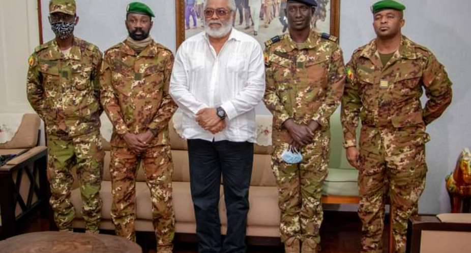 Flt. Lt. Rawlings in a group picture with Mali's Military Junta