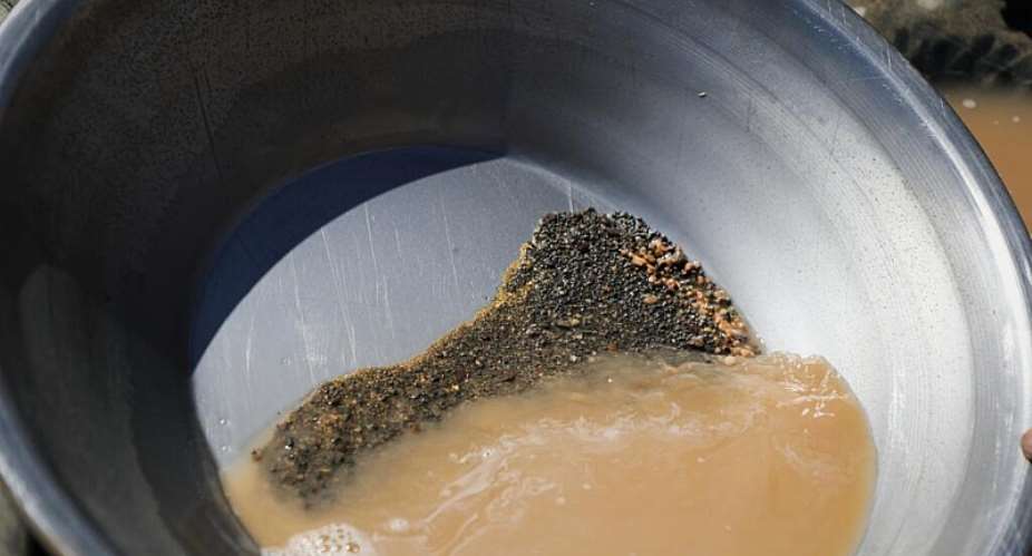 A pan containing gold-bearing sediment and heavy mineral concentrate sits at an artisanal mining site in Sudan on May 8, 2026. -  Mohnd Bla, AP