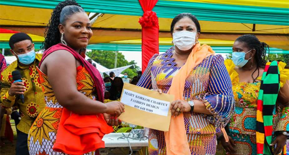 Mary Korkor Chartey , a graduate receiving her start-up kit from First Lady, Mrs Rebecca Akufo-Addo.