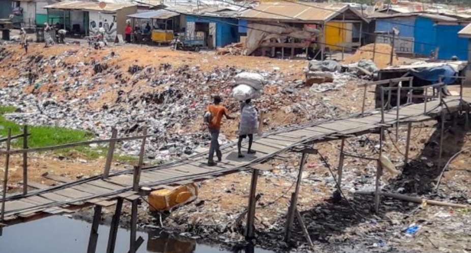 Slum Dwellers At Old Fadama Beg For Footbridge Over Agbogbloshie Drain