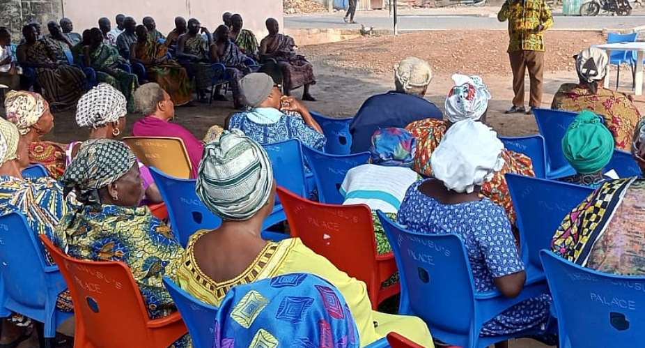 Ho NCCE Director Rev. Adzika interacting with Community members