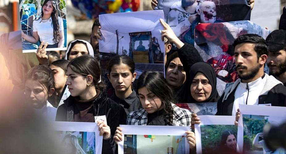 People in Syrias northeastern city of Qamishli protest against sectarian violence targeting the Alawite minority, in March 2025. -  Delil Souleiman, AFP