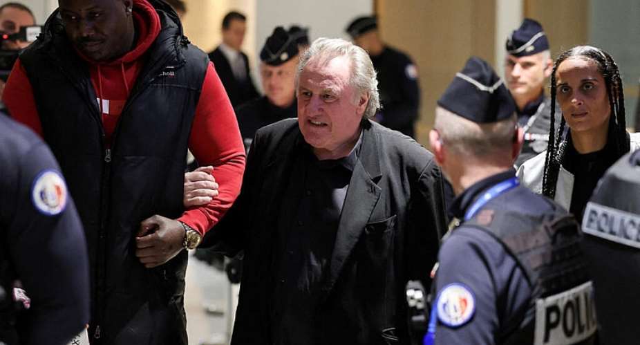 French actor Gerard Depardieu walks through a courthouse, at his trial over accusations of sexual assault in Paris, 27 March 2025. -  Gonzalo Fuentes / Reuters