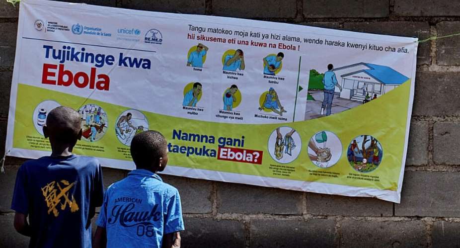 Congolese children read an Ebola awareness poster in Bunia, Ituri province, in the Democratic Republic of Congo. - REUTERS - Gradel Muyisa Mumbere