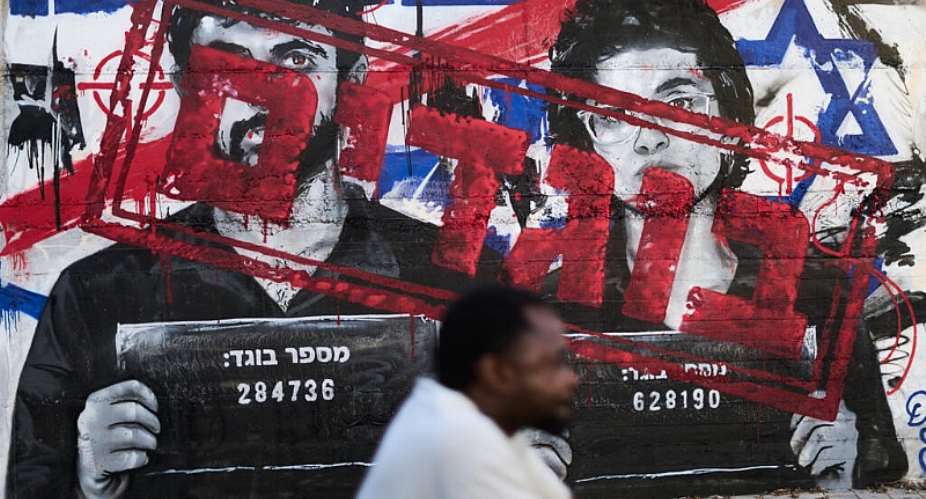 Graffiti showing Israeli directors Rachel Szor and Yuval Abraham, winners of a special jury prize for their film Naza, with the words traitors, Ashdod, Israel; September 15, 2026. -  Ariel Schalit, AP