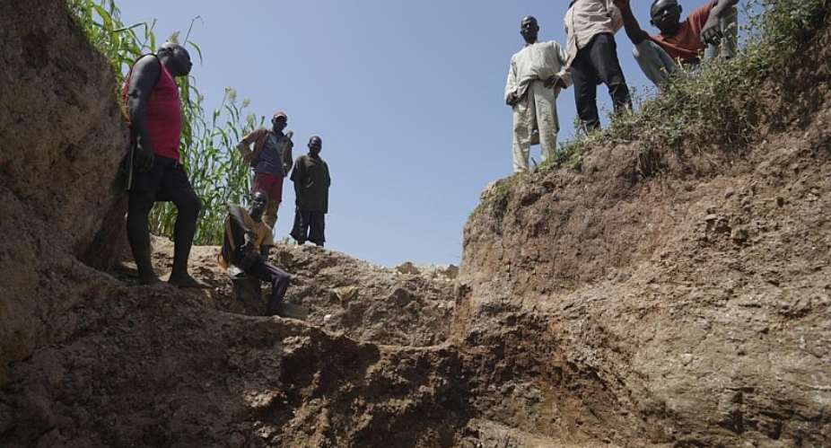 Workers stand at an illegal lithium mine in Paseli, Nigeria, 5 November 2024. -  Sunday Alamba, AP