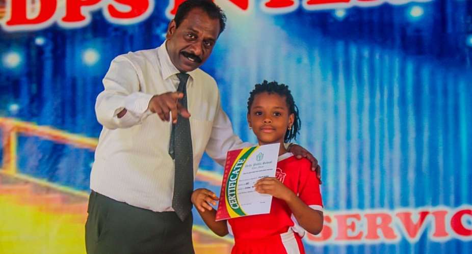 Mr David Raj, Headmaster Of DPS International Ghana With One Of The Winners Of The Recitation Competition