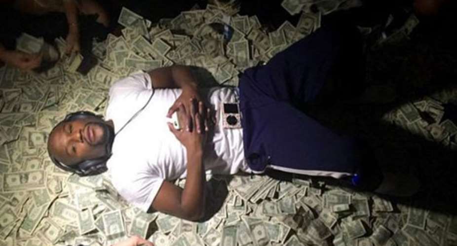 Floyd Mayweather on a pile of cash