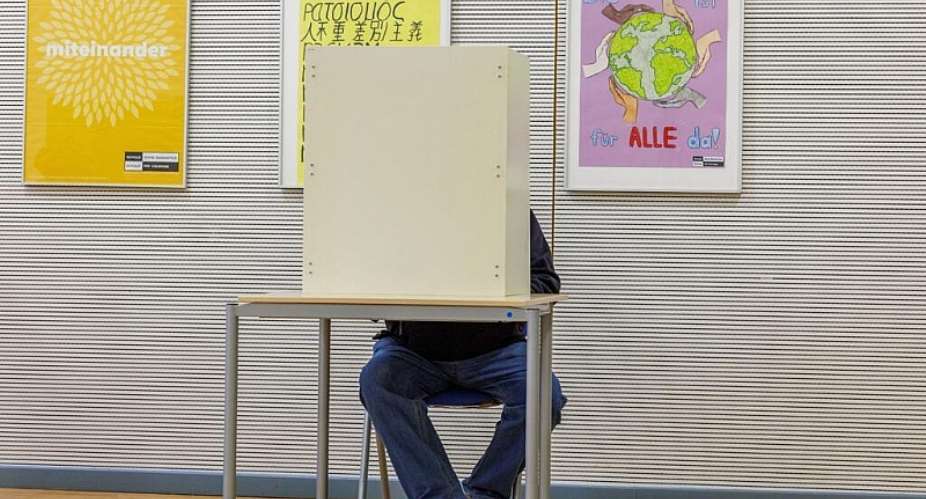 A voter marks his ballot for the state election in Mecklenburg-Western Pomerania, in Schwerin, Germany, September 20, 2026. -  Jens Battner, AP