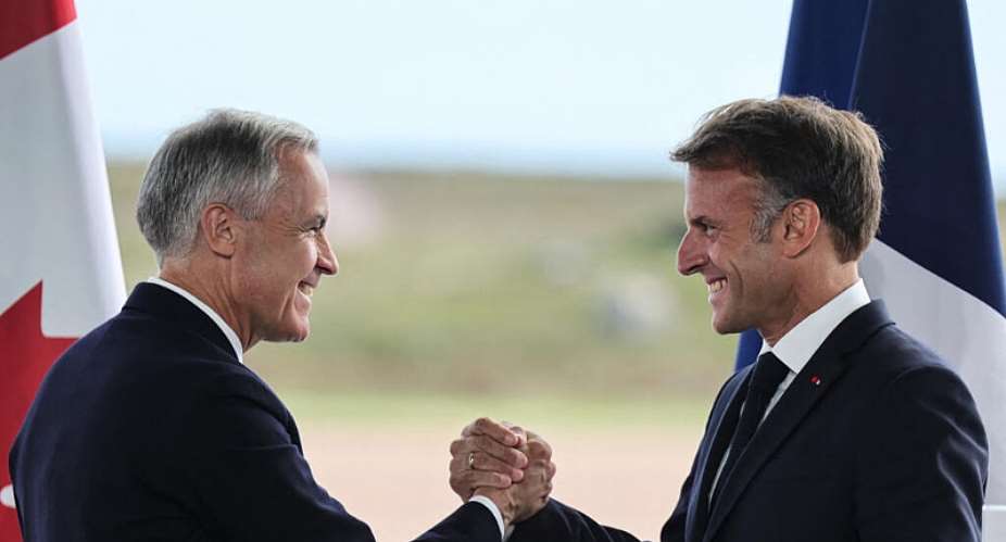 French President Emmanuel Macron (R) and Canadian Prime Minister Mark Carney (L) hold a joint press statement in Saint-Pierre on September 20, 2026. -  Ludovic Marin, AFP