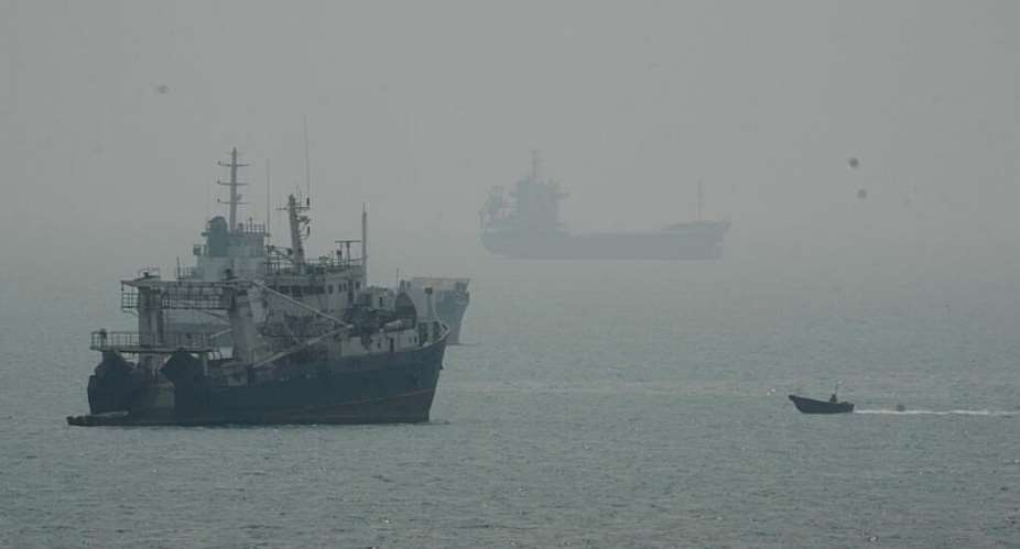 A file image of a motorboat travelling past commercial vessels anchored amid haze in the Strait of Hormuz off Bandar Abbas, Iran, on September 7, 2026. -   Vahid Salemi, AP