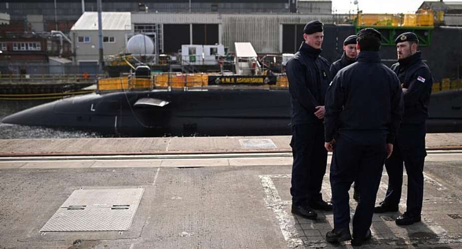 Royal Navy Submariners of the HMS Agamemnon nuclear submarine speak during a joint visit of Britains Prime Minister Keir Starmer and Britains Defence Secretary John Healey, in Barrow-in-Furness, United Kingdom, 20 March 2025. -  Oli Scarff, AFP