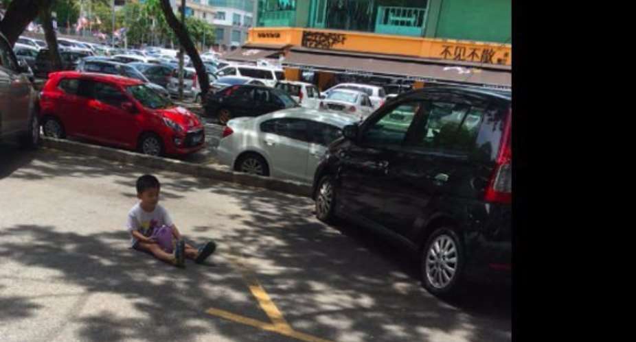 Mum forces toddler son to sit in parking to save her a spot