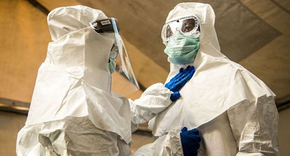 Medical staff prepare to enter a hospital isolation unit in western Uganda during a suspected Ebola outbreak in 2018. - Source: Photo by Sumy SadurniAFP via Getty Images