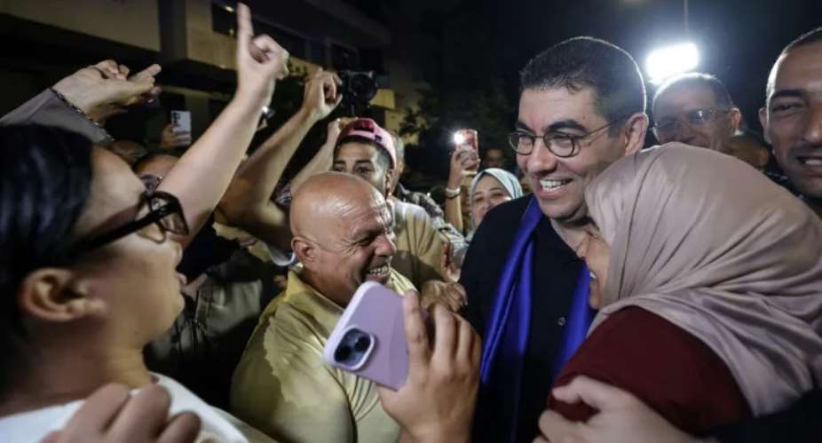 Moroccos Minister of Youth, Culture and Communication and member of the collective leadership of the Authenticity and Modernity Party (PAM), Mohamed Mehdi Bensaid (2nd R), celebrates with party members after the announcement of the provisional results (Abdel Majid BZIOUAT)