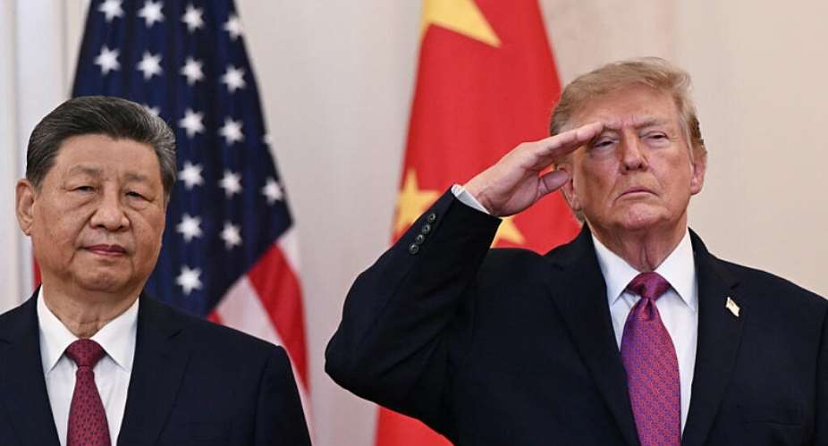 US President Donald Trump and Chinas President Xi Jinping stand in the Cross Hall of the White House. -  Brendan Smialowski, AFP