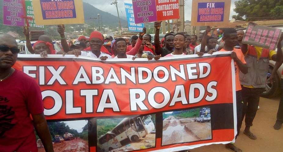 VR: Group Goes Red; Hits Street Over Bad Roads Photos