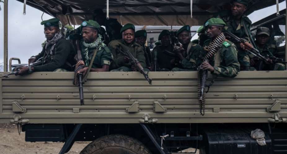 Soldiers are seen near Mutwanga, Democratic Republic of Congo, on May 24, 2021. Military officers recently detained journalist Pierre Sosthne Kambidi and are holding him without charge. AFPAlexis Huguet
