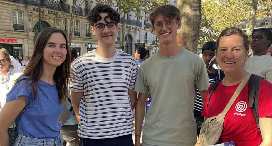 Alexandra (L) and Laure DHaussy (R) speak to Martin and Gabriel about Jesus during Pope Leo XIVs visit to Paris on September 25, 2026. -  Lara Bullens