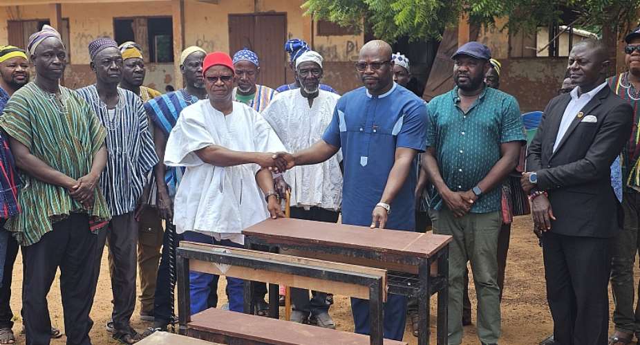 Binaba Chief donates dual desks to Binaba Primary School to end furniture crisis