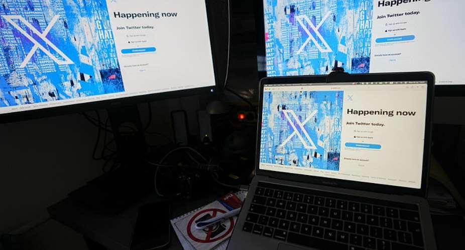 A file image of computer monitors and a laptop displaying the X sign-in page on July 24, 2023, in Belgrade, Serbia. -  Darko Vojinovic, AP