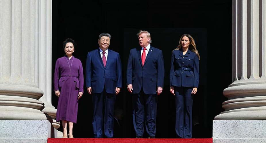 US President Donald Trump, First Lady Melania Trump, Chinas President Xi Jinping and his wife Peng Liyuan stand together as they arrive to visit the National Archives in Washington. -  Saul Loeb, AFP