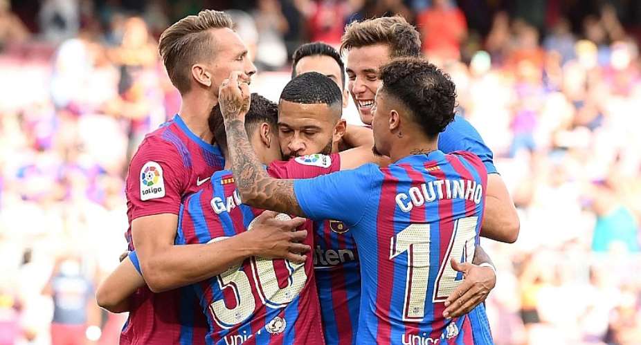 Memphis Depay of FC Barcelona celebrates after scoring their side's first goal with team mates during the LaLiga Santander match between FC Barcelona and Levante UD at Camp Nou on September 26, 2021 in Barcelona, Spain.Image credit: Getty Images