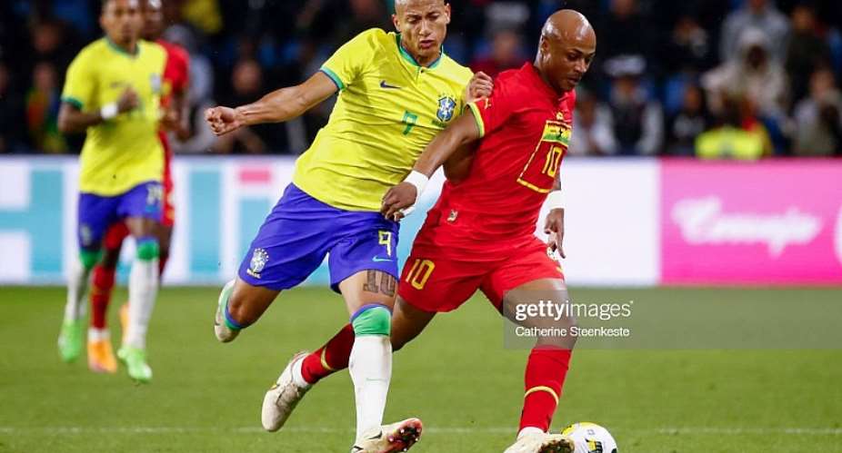 LE HAVRE, FRANCE - SEPTEMBER 23: Richarlison 9 of Brazil challenges Andre Ayew 10 of Ghana during the international friendly match between Brazil and Ghana at Stade Oceane on September 23, 2022 in Le Havre, France. Photo by Catherine SteenkesteGetty Images