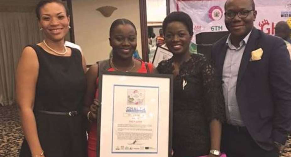 Lucy Quist 2nd from right- was named the CSR CEO of the Year at the 2016 Ghana CSR Excellence Awards. With her at the ceremony include Hannah Agbozo left- Legal Corporate Affairs Director, Richard Ahiagble Right- Head of Corporate Communications an