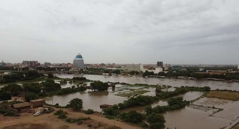 A view of flooded farmland on the riverbank and swelling Blue Nile as its water level rises after heavy rainfall in Khartoum, Sudan  - Source: Photo by Mahmoud HjajAnadolu Agency via Getty Images