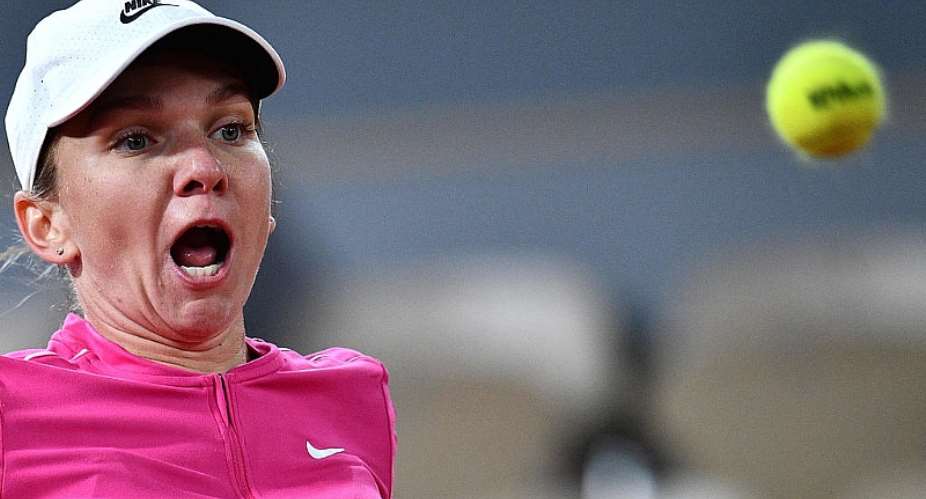 Halep celebrates birthday with win under the centre court roof at French Open