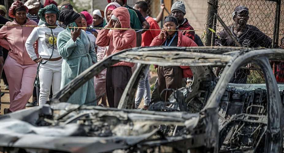 Suspects in the Johannesburg shooting torched two vehicles before fleeing. -  Emmanuel Croset, AFP